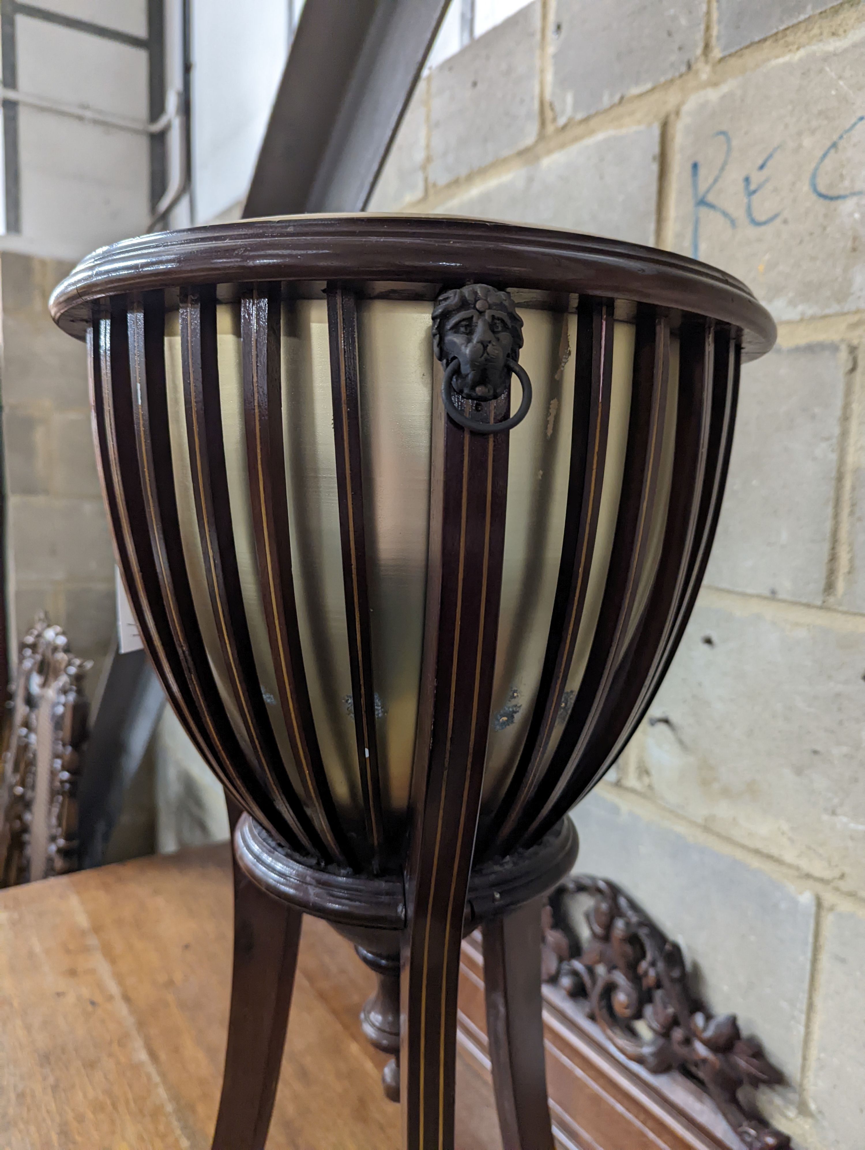 An Edwardian style inlaid mahogany jardiniere, height 85cm